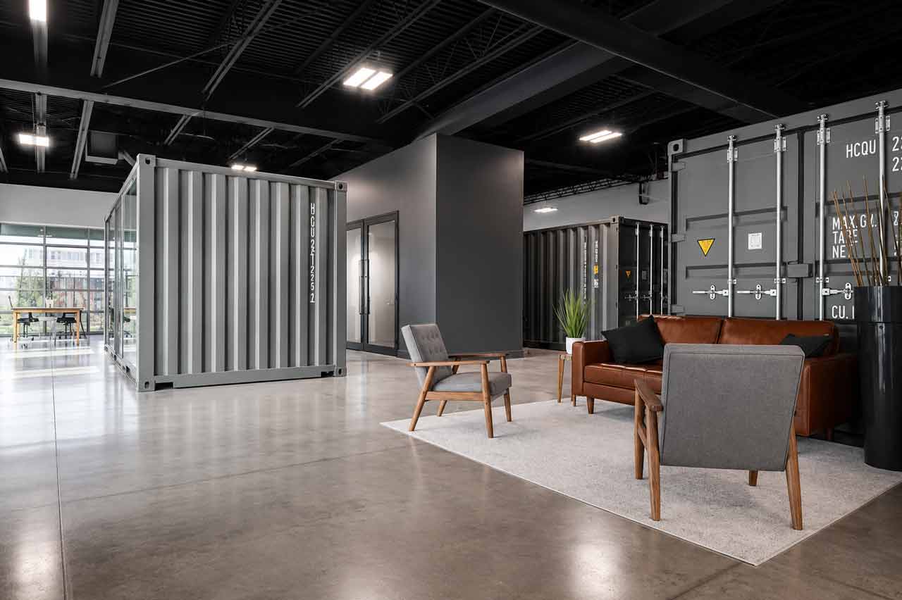 The Industry coworking space buildout in Bonita Springs, Florida, featuring repurposed shipping containers, completed by Fort Construction